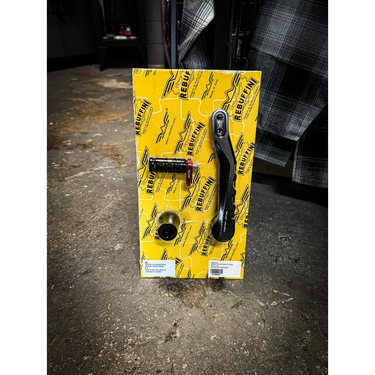 Motorcycle foot controls on yellow packaging.